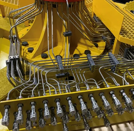 Hydraulic tubing manifold and fittings installed across an offshore tooling package