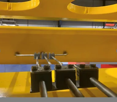 Tube supports and clamps holding hydraulic lines clear of moving components