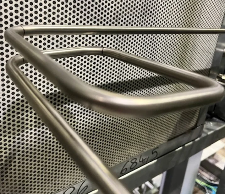 Precision-bent stainless steel tubing assemblies prepared for a screw compressor package