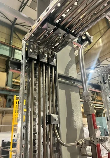 Tube runs routed and clamped through the package framework