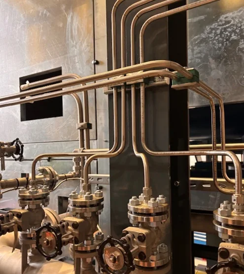 Instrumentation tubing connected to process valves on a compressor package